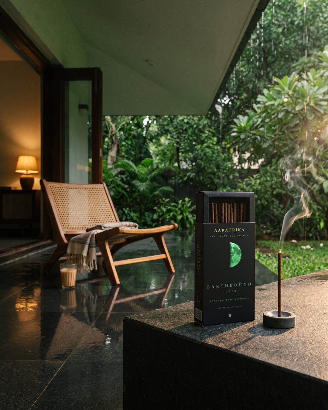 A veranda open to a garden after rain